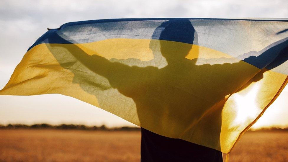 Image of A Man Standing With Ukrainian Banner | decorative purposes